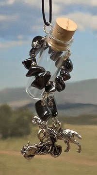 Hematite stonewrap aromanecklace with a wolf and motorcycle